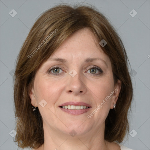 Joyful white adult female with medium  brown hair and grey eyes