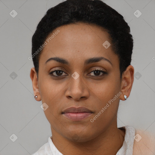 Joyful black young-adult female with short  black hair and brown eyes