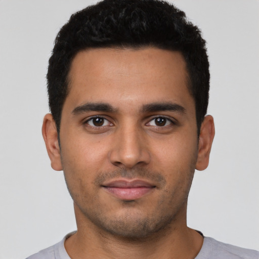 Neutral latino young-adult male with short  black hair and brown eyes