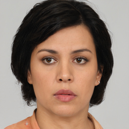 Neutral asian young-adult female with medium  brown hair and brown eyes