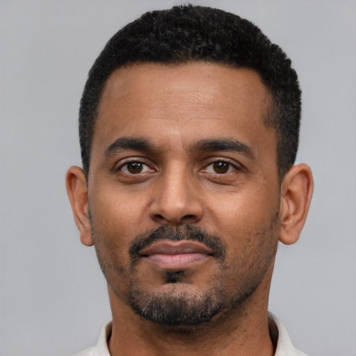 Neutral black young-adult male with short  black hair and brown eyes