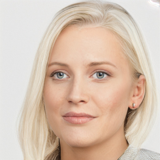 Joyful white young-adult female with long  brown hair and blue eyes