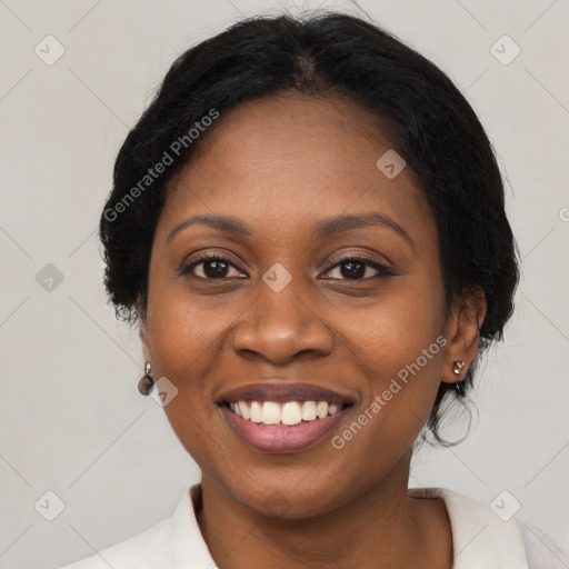 Joyful black adult female with medium  black hair and brown eyes