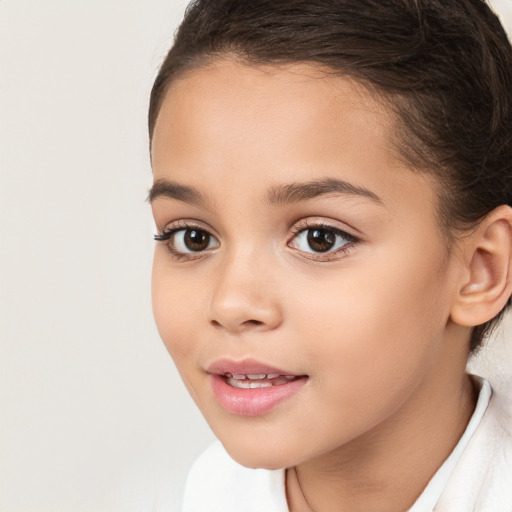 Joyful white child female with short  brown hair and brown eyes