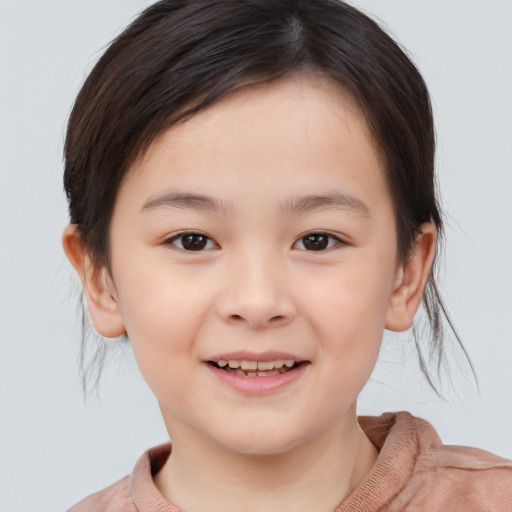 Joyful white child female with medium  brown hair and brown eyes