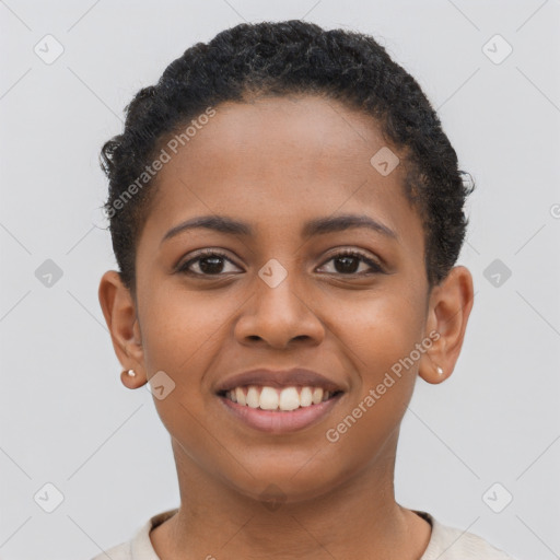 Joyful black young-adult female with short  brown hair and brown eyes