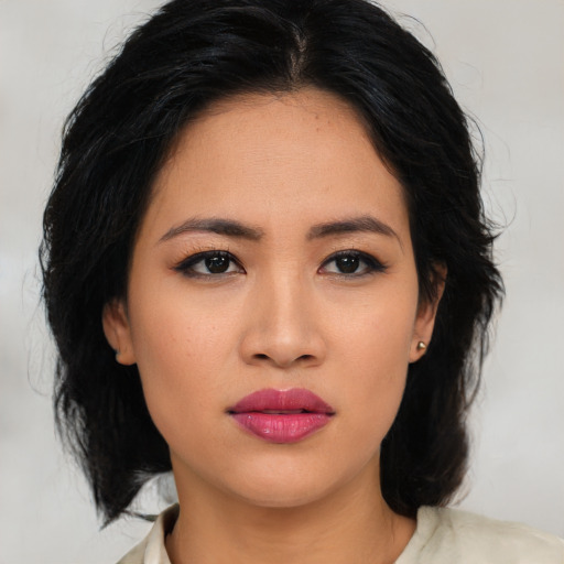 Neutral asian young-adult female with medium  brown hair and brown eyes