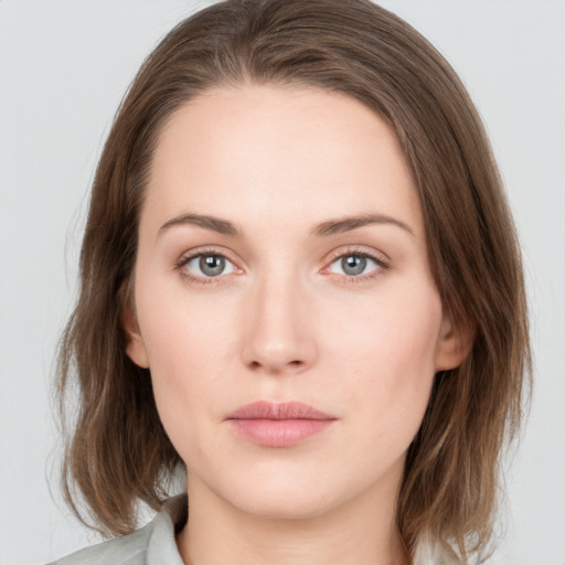 Neutral white young-adult female with medium  brown hair and green eyes