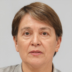 Joyful white middle-aged female with short  brown hair and brown eyes