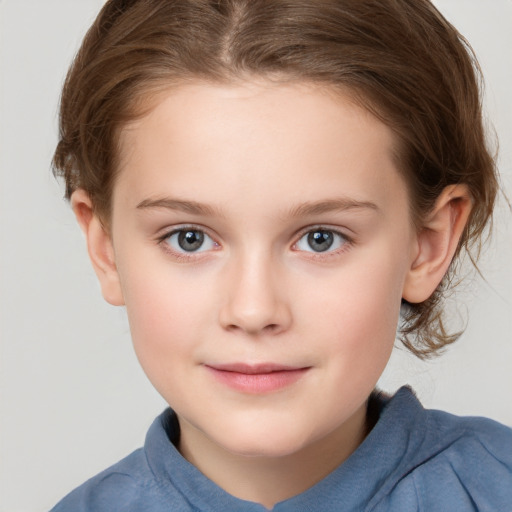 Joyful white child female with medium  brown hair and grey eyes