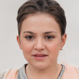 Joyful white child female with short  brown hair and brown eyes