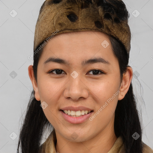 Joyful latino young-adult female with medium  brown hair and brown eyes