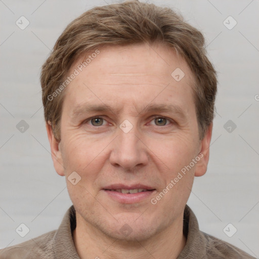 Joyful white adult male with short  brown hair and grey eyes