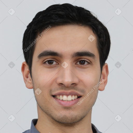 Joyful white young-adult male with short  black hair and brown eyes