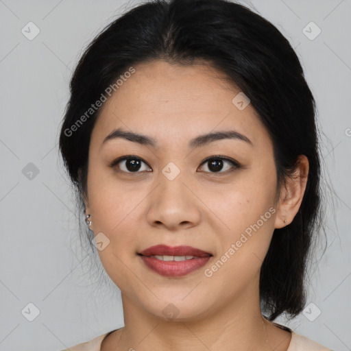 Joyful asian young-adult female with medium  black hair and brown eyes