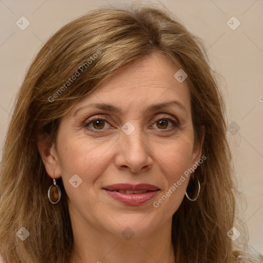 Joyful white adult female with long  brown hair and brown eyes