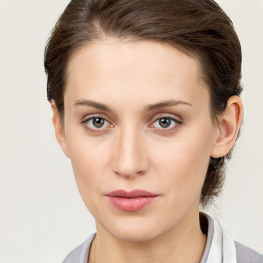 Neutral white young-adult female with medium  brown hair and grey eyes