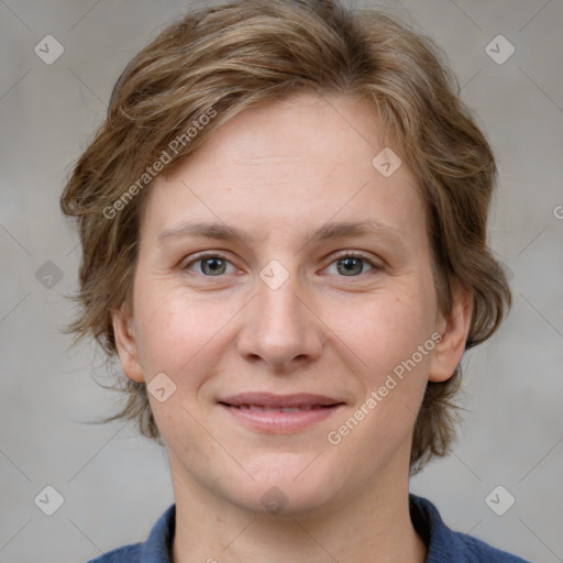 Joyful white young-adult female with medium  brown hair and blue eyes