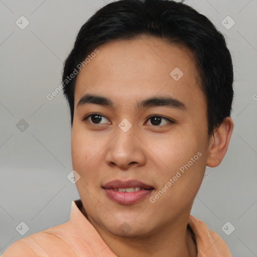 Joyful asian young-adult male with short  black hair and brown eyes
