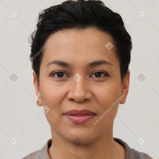 Joyful latino young-adult female with short  black hair and brown eyes