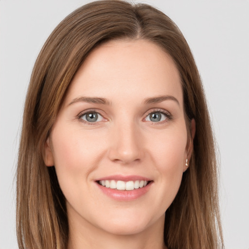 Joyful white young-adult female with long  brown hair and grey eyes