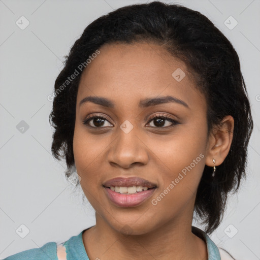 Joyful black young-adult female with long  black hair and brown eyes