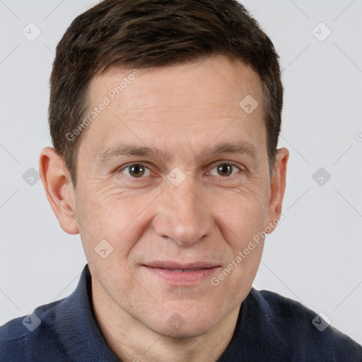 Joyful white adult male with short  brown hair and grey eyes