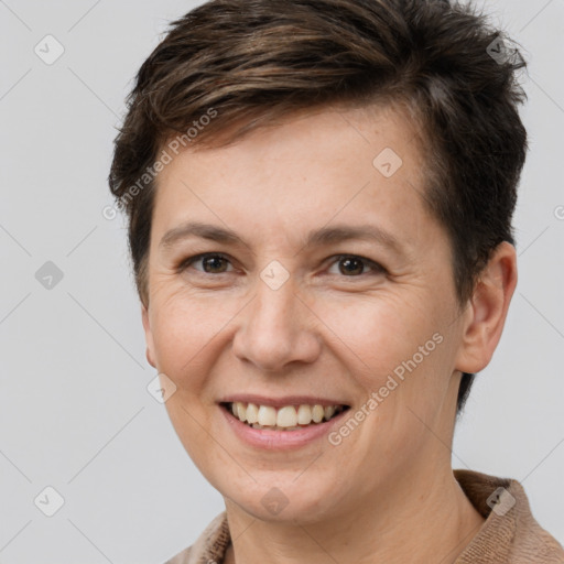 Joyful white adult female with short  brown hair and brown eyes