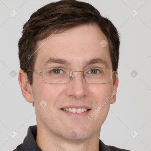 Joyful white adult male with short  brown hair and grey eyes