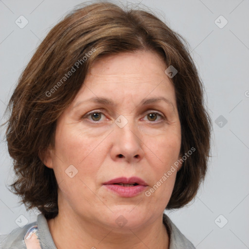 Joyful white adult female with medium  brown hair and grey eyes