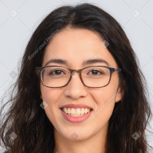 Joyful latino young-adult female with long  brown hair and brown eyes