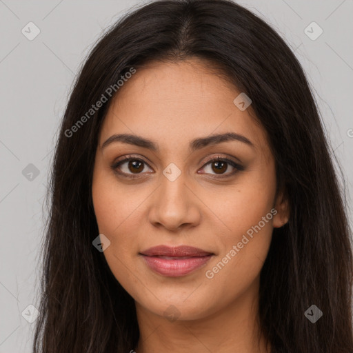 Joyful latino young-adult female with long  brown hair and brown eyes