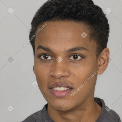 Joyful black young-adult male with short  brown hair and brown eyes