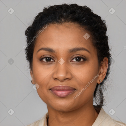 Joyful black young-adult female with medium  black hair and brown eyes