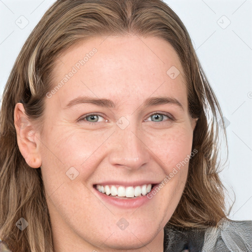 Joyful white young-adult female with long  brown hair and blue eyes