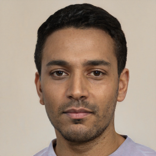 Neutral latino young-adult male with short  black hair and brown eyes