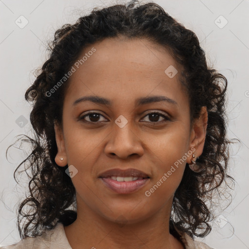 Joyful black young-adult female with long  brown hair and brown eyes