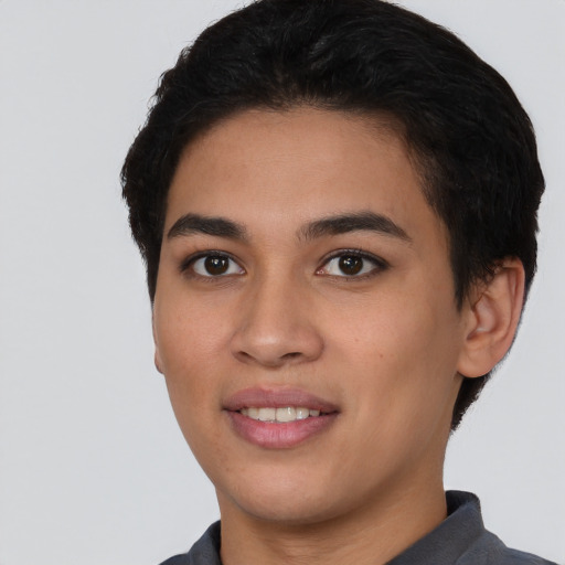 Joyful latino young-adult female with short  black hair and brown eyes