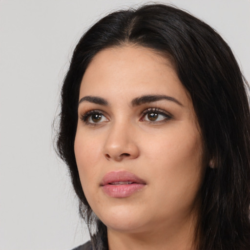 Neutral latino young-adult female with long  black hair and brown eyes