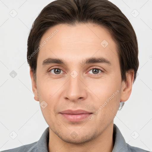 Joyful white young-adult male with short  brown hair and brown eyes