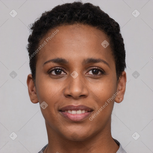 Joyful black young-adult female with short  black hair and brown eyes