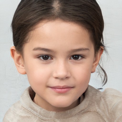 Joyful white child female with medium  brown hair and brown eyes