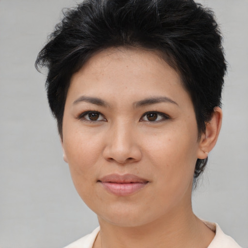 Joyful asian young-adult female with short  brown hair and brown eyes