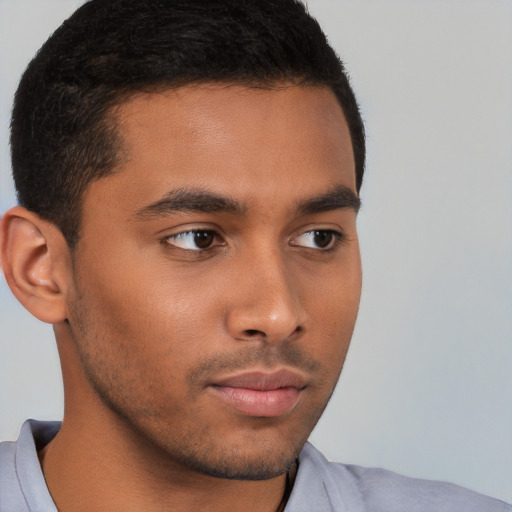 Neutral latino young-adult male with short  brown hair and brown eyes