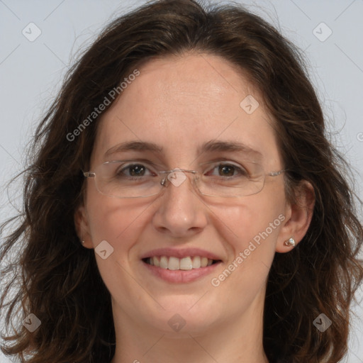 Joyful white adult female with long  brown hair and brown eyes