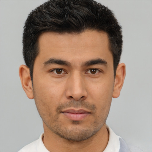 Neutral latino young-adult male with short  brown hair and brown eyes