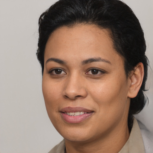 Joyful latino young-adult female with short  brown hair and brown eyes
