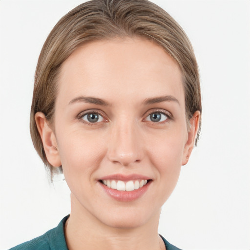 Joyful white young-adult female with medium  brown hair and grey eyes