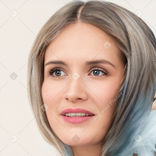 Joyful white young-adult female with medium  brown hair and blue eyes