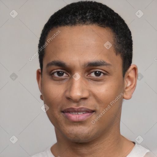 Joyful black young-adult male with short  black hair and brown eyes